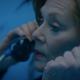 Agent Laurie Blake making a phone call to an old friend.